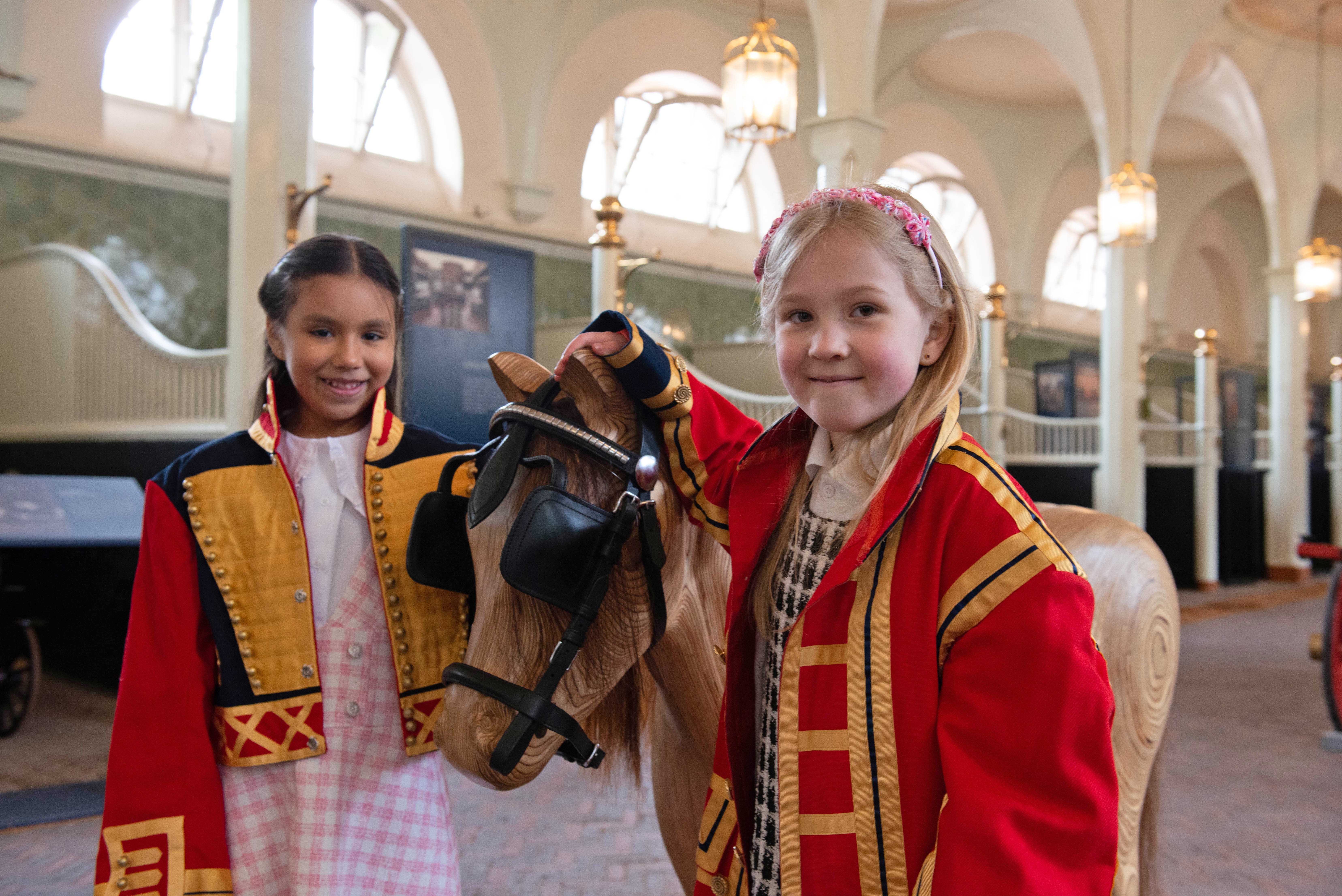 Family visitors enjoying the Royal Mews