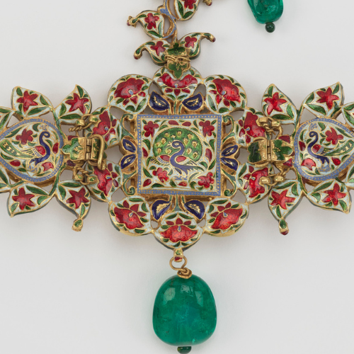Detail of the sarpech's reverse side, which s enamelled in red, green, white and blue with flowers and peacocks.