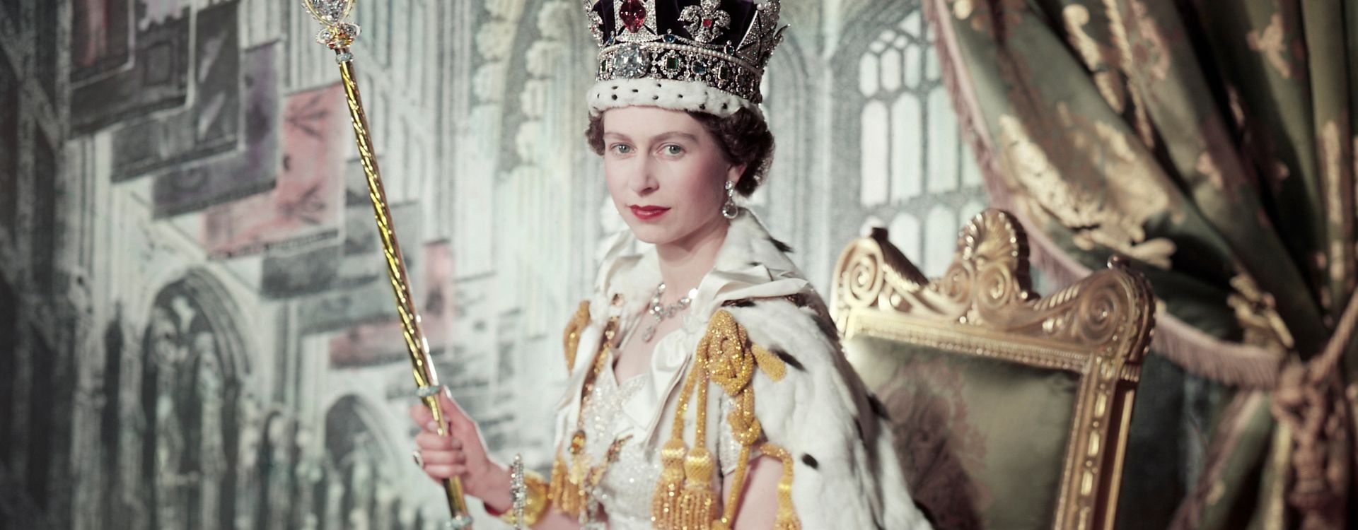 Queen Elizabeth II on her Coronation Day (RCIN 2153177) Queen Elizabeth II sits on a throne wearing her coronation robes