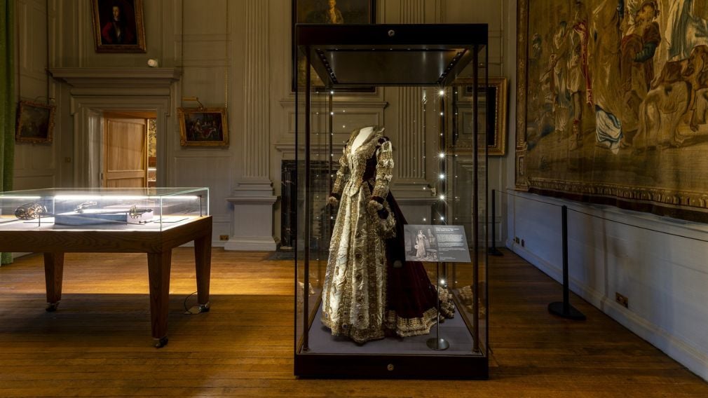 A dress on display in a glass cabinet