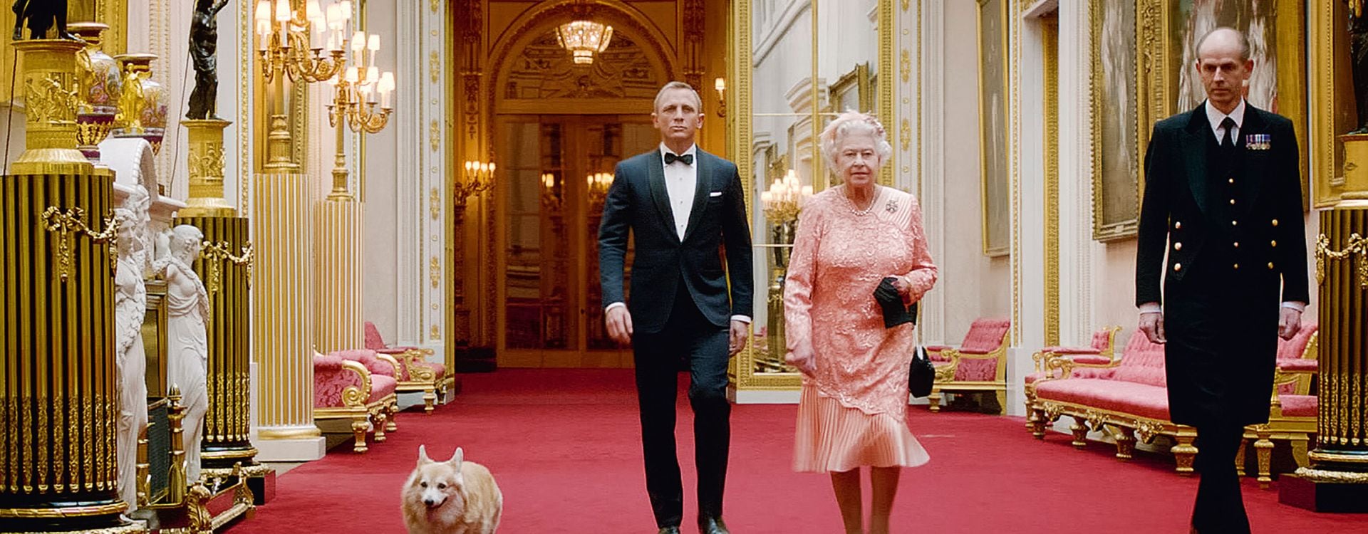 Queen Elizabeth II and James Bond from the London 2012 Olympic Games Ceremony. Queen Elizabeth II and James Bond walking in Buckingham Palace from the London 2012 Olympic Games Ceremony.