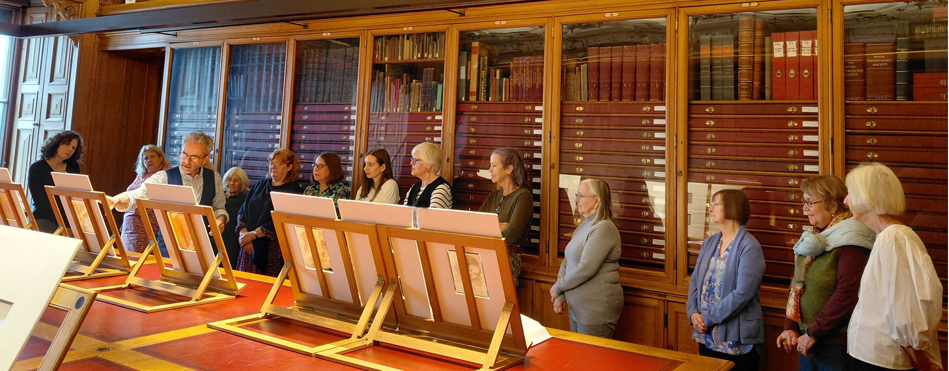 Martin Clayton showing Leonardo drawings to an RSN students in The Print Room, Windsor Castle