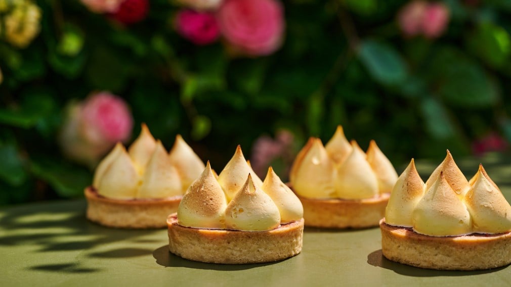 Freshly baked Queen of Puddings - a classic English dessert of lemon and vanilla custard, raspberry jam, and delicate burnt meringue Freshly baked Queen of Puddings - a classic English dessert of lemon and vanilla custard, raspberry jam, and delicate burnt meringue
