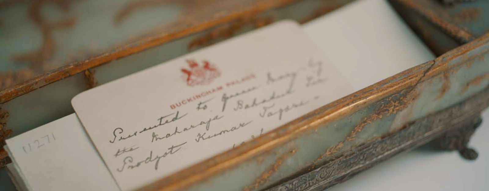 A jade box with a handwritten letter inside