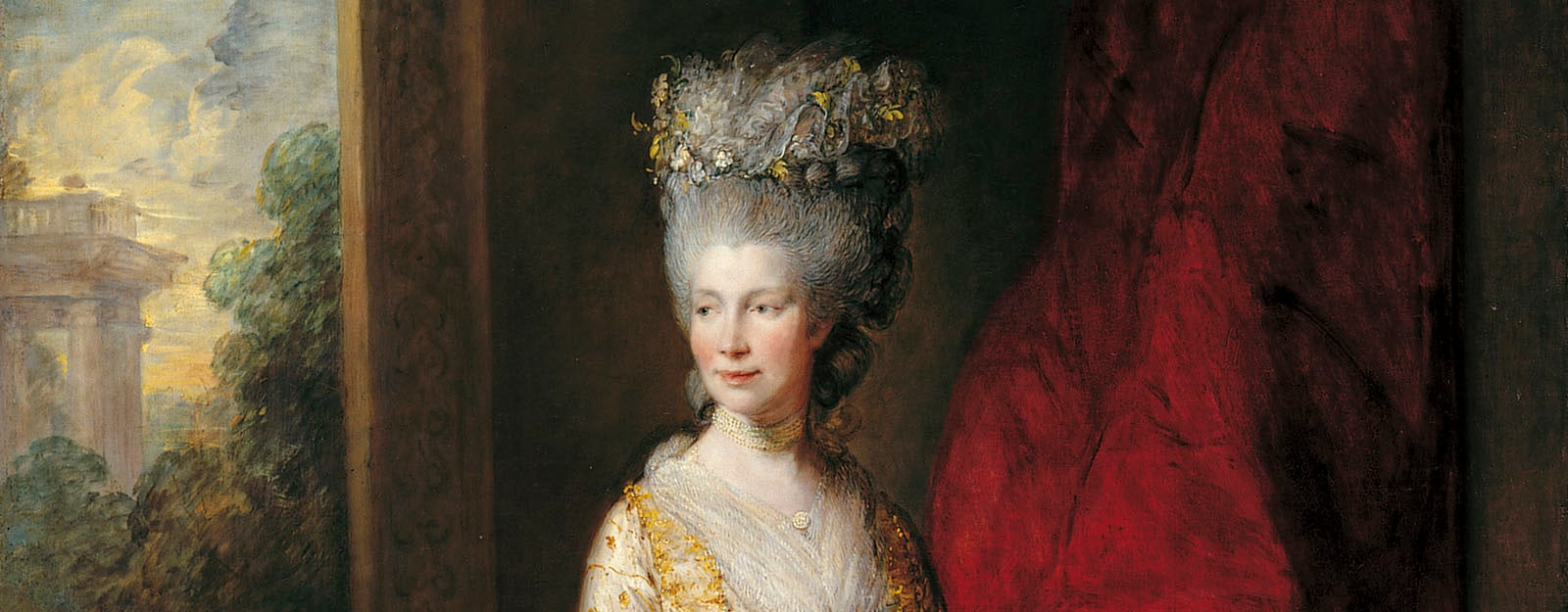 Queen Charlotte wearing a gold tasseled silk dress.