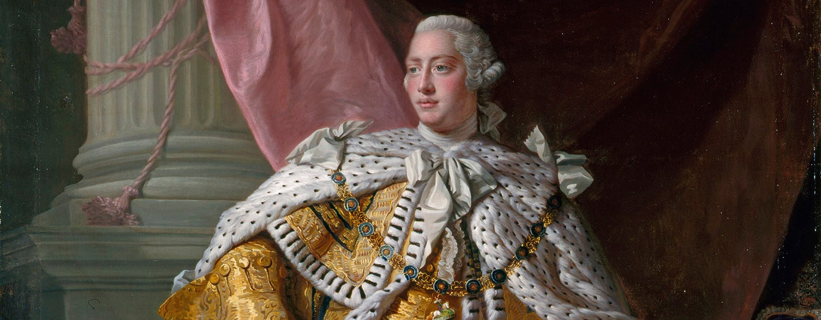 George III stands wearing his yellow coronation robes.