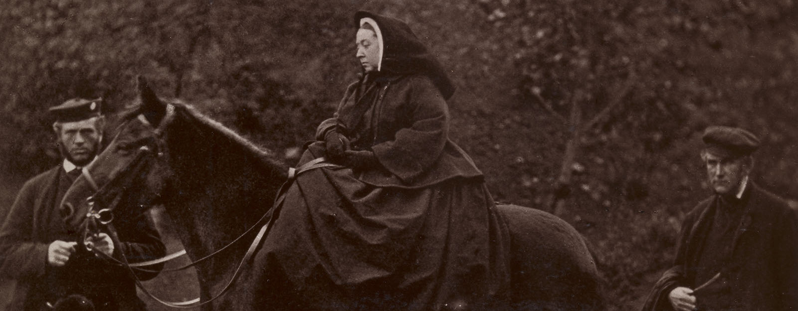Queen Victoria on top of a horse next to her steward