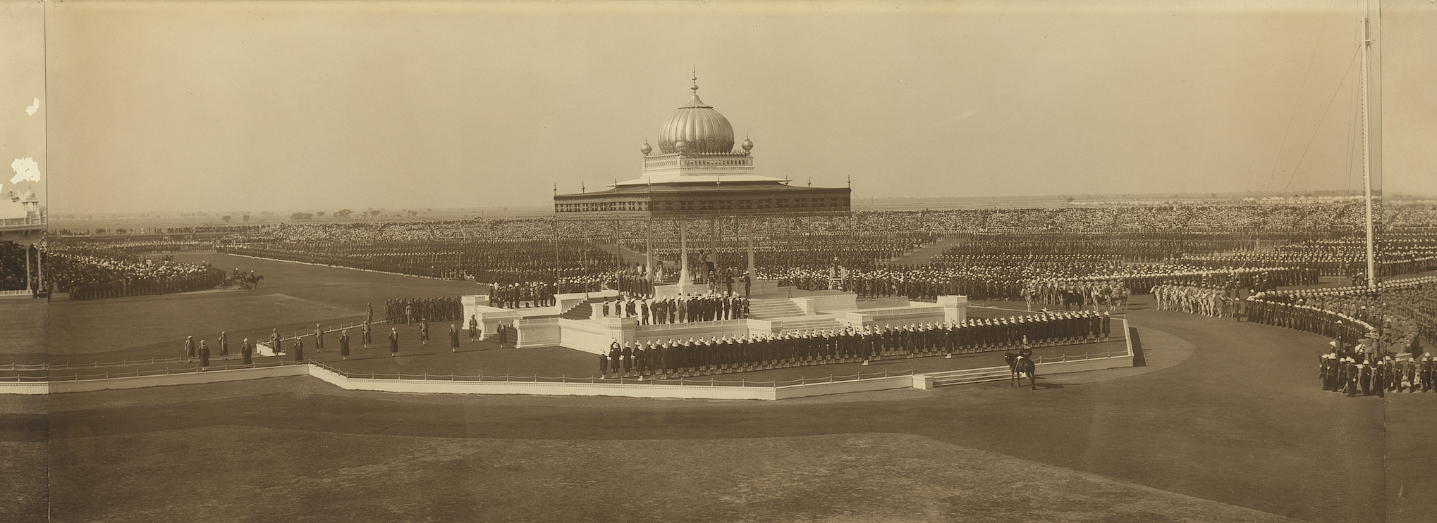 Second gelatin silver photograph framed alongside each other to form a panorama of three individual key moments taken during the Delhi Durbar of 1911. Each photograph features King George V and Queen Mary.