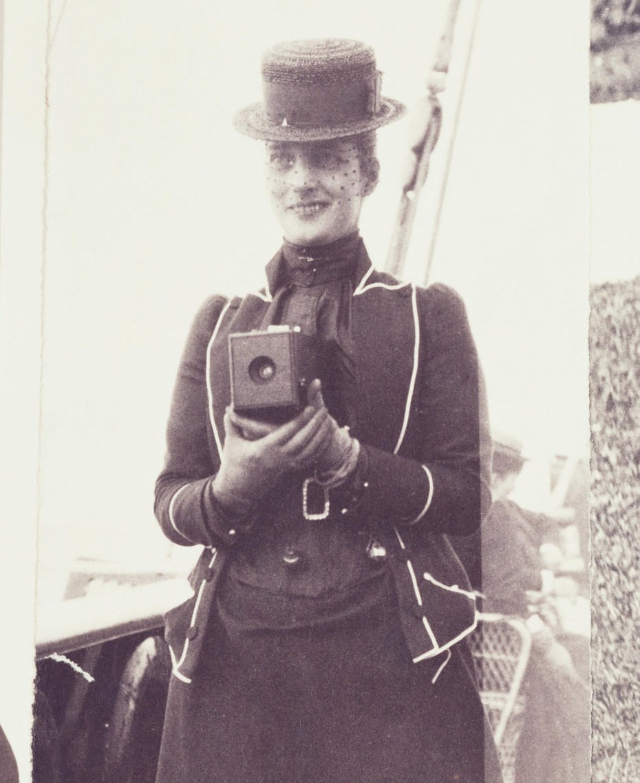Queen Alexandra (1844-1925), when Princess of Wales, with her Camera Photograph of the Princess of Wales, later Queen Alexandra, holding a No.1 Kodak camera at chest height. She is standing on the deck of a ship. The No.1 Kodak camera was introduced in 1889 and took small circular photographs. There are many exa
