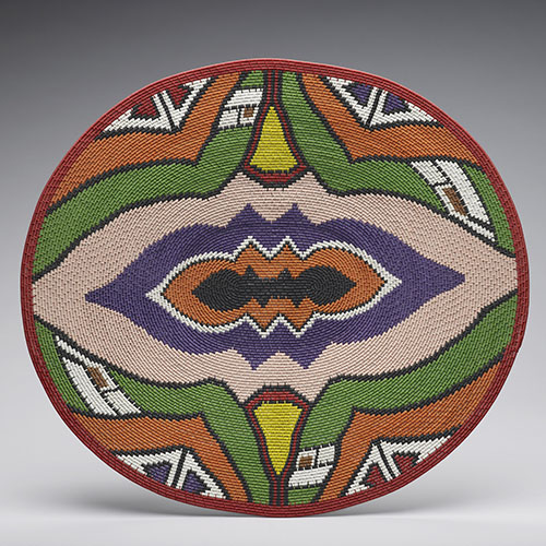 A Zulu basket made from recycled telephone wire. RCIN 102892. A colorful basket or cover made from recycled telephone wire