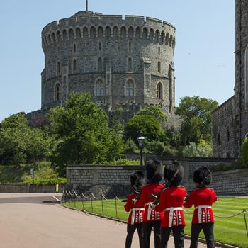 Outside of Windsor Castle's Round Tower with guards walking outside