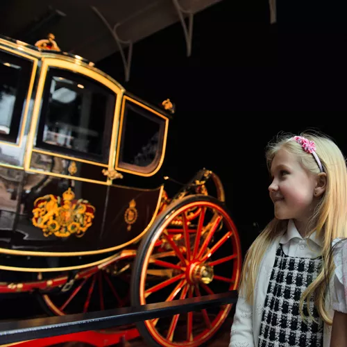 A young visitor in the Royal Mews