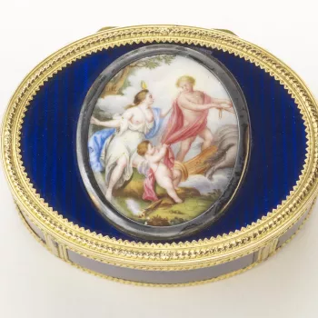 Oval gold and enamel snuff box, the hinged cover mounted&nbsp;with an oval enamel plaque, painted with a scene of Mars and Venus with the infant Cupid. The box&nbsp;with a&nbsp;blue guilloch&eacute; enamel ground, divided by chased gold borders. 
The tale