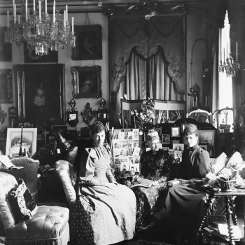 Photograph of Empress Marie Feodorovna of Russia (1847-1928), and Queen Louise of Denmark (1817-98), and Alexandra, Princess of Wales (1844-1925), all seated, surrounded by much furniture, including screens of photographs and framed photographs, in a sitt