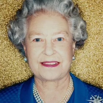 A head and shoulders photographic portrait&nbsp;of HM Queen Elizabeth II taken at Buckingham Palace. This is one of a portfolio of photographs commissioned to mark the fiftieth anniversary of The Queen's Accession in 2002. The Queen is photographed agains