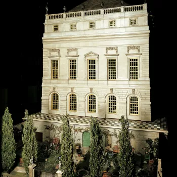 Queen Mary's Dolls' House was created as a 1:12 scale miniature royal palace or town house as a gift from the nation to Queen Mary. The House, with a fa&ccedil;ade in the style of Sir Christopher Wren or Inigo Jones, is operated by a mechanism in the base