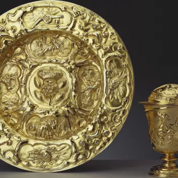 A silver-gilt basin embossed with military trophies. Four panels, on the inner rim of the basin, depict the Labours of Hercules.