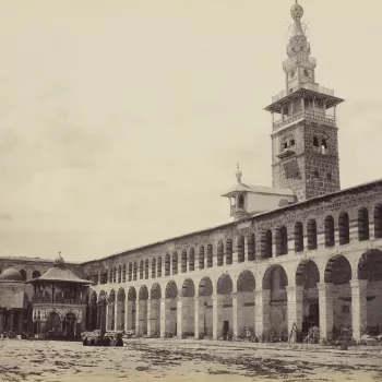View across the court of the mosque from the north side. Colonnade runs the length of the interior, tower above. Fountain covered by pavilion to the left.

The photograph is signed, captioned and dated in the negative, 'F Bedford Damascus'. The number i