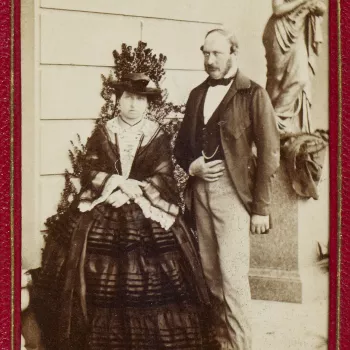 Carte-de-visite of Queen Victoria (1819-1901) and Prince Albert, Prince Consort (1819-1861) at Osborne in the 1850s. The photograph shows the Queen and Prince Albert standing together in front of a statue of a woman, with the Queen on the left.&nbsp;Queen