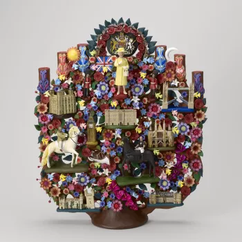 A Tree of Life featuring Queen Elizabeth II modelled from clay and decorated with colourful symbols representing British culture and the interests of Her Majesty. In a red leather presentation box with a gold embossed symbol of Mexico and 'MEXICO / PRESID