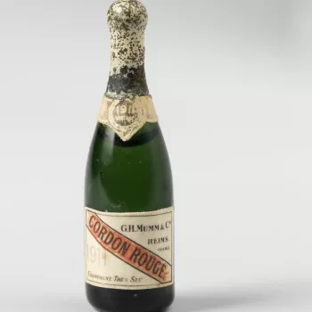 Miniature green glass bottle of vintage champagne (Mumm)