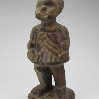 Modern copy of a Bieri (reliquary guardian). The original Bieris would have stood in a family home of the Fang people, to remember a deceased ancestor. Traditional reliquary guardians protect and mark the location of ancestor&rsquo;s remains.
Statue of a 