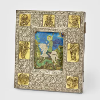 Enamel picture of St George on a white horse slaying the dragon in a green hilly abstract landscape containing Nushkuri&nbsp;letters. Four studs in corners of enamel, top two containing goldstone cabochons and bottom two with malachite cabochons. White me