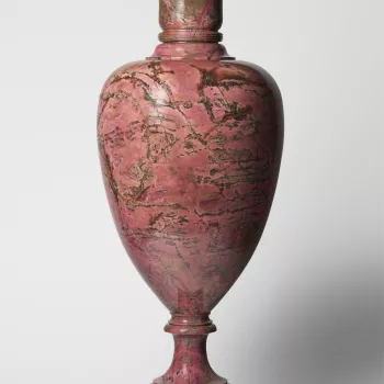 A detachable baluster shape dark pink veined marble vase and cover. From the end of the 18th century stone cutting became an important craft in the Russian city of Ekaterinburg. The vase is marked with an inscription in cyrillic which translated reads: 18