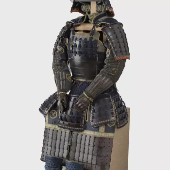 This unsigned armour is of the &lsquo;body-wrapped&rsquo; (dōmaru) type introduced in the late Kamakura period (1185&ndash;1333). Thanks to its relative lightness, the style soon became popular with higher-ranking samurai. Warfare in Japan had changed ra