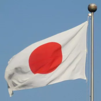Cropped Creative Commons-licensed image of Japanese flag flying in Tokyo