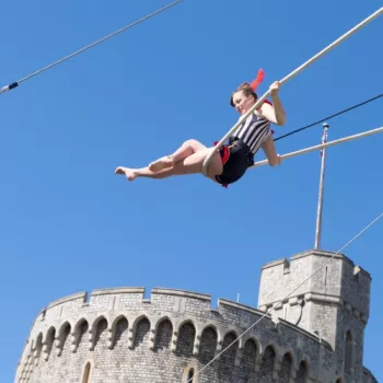 acrobat with the Round Tower at Windsor in the background 