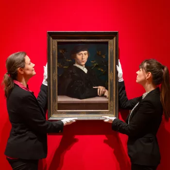 Curators make final adjustments to the portrait of Derich Born by Hans Holbein the Younger