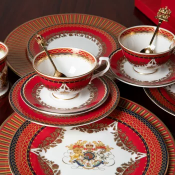 A selection of plates, teacups and saucers decorated in red, black and white