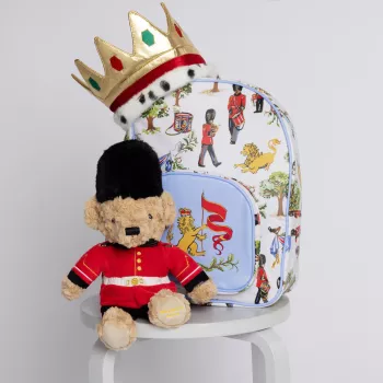 The new children's product range by Royal Collection Trust showing a bear, a dress-up crown and new backpack