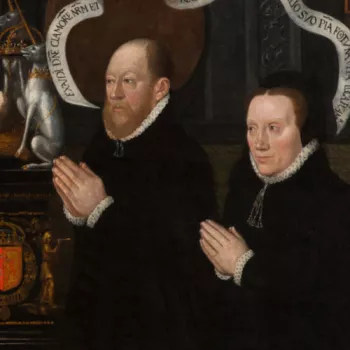 Two people praying in the Memorial for Lord Darnley