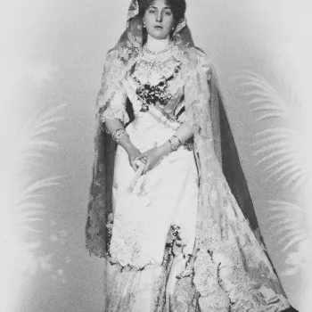 Photograph of a full length portrait of Queen Victoria Eugenie in her wedding dress