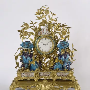 The misnamed &lsquo;kylins&rsquo; of the time-honoured title of this clock are the pair of squatting lions of turquoise- and purple-glazed porcelain from the first half of the eighteenth century which flank the clock case, their open jaws displaying their