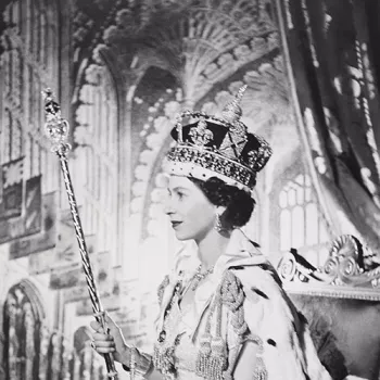 Photograph of Queen Elizabeth II wearing coronation robes and holding Coronation Regalia.