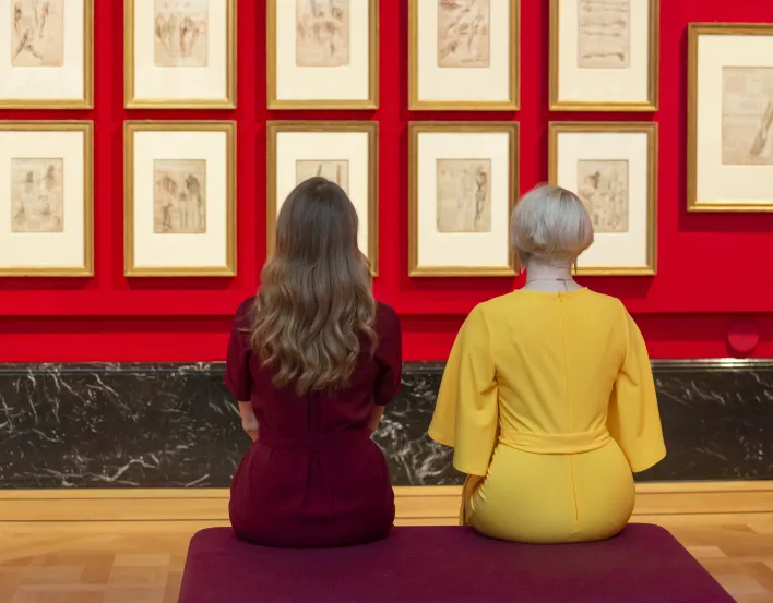 Two people enjoying the Leonardo exhibition in The Queen's Gallery
