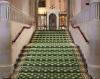 A view of the patterned green stairs leading up to a State Room at Windsor Castle
