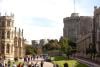 View from the Lower Ward of Windsor Castle up to the Round Tower, with people and stone buildings.
