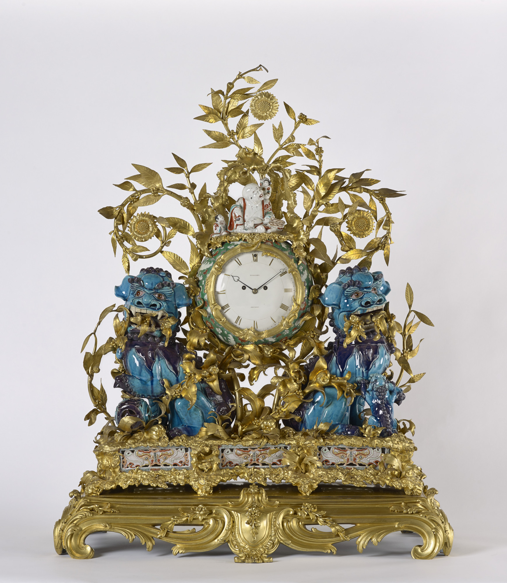 The misnamed &lsquo;kylins&rsquo; of the time-honoured title of this clock are the pair of squatting lions of turquoise- and purple-glazed porcelain from the first half of the eighteenth century which flank the clock case, their open jaws displaying their