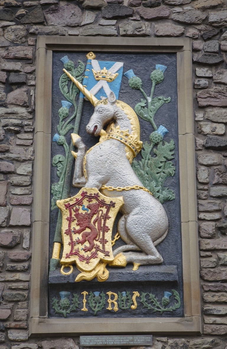 A unicorn featured in a coat of arms, on a wall at the Palace of Holyroodhouse A coat of arms high up on a wall