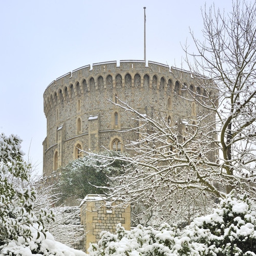 The Round Tower at Windsor Castle covered in snow Photograph of the